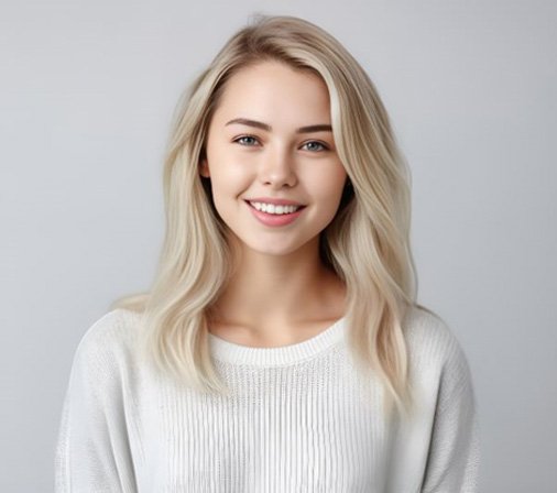 Young woman with soft smile and beautiful teeth