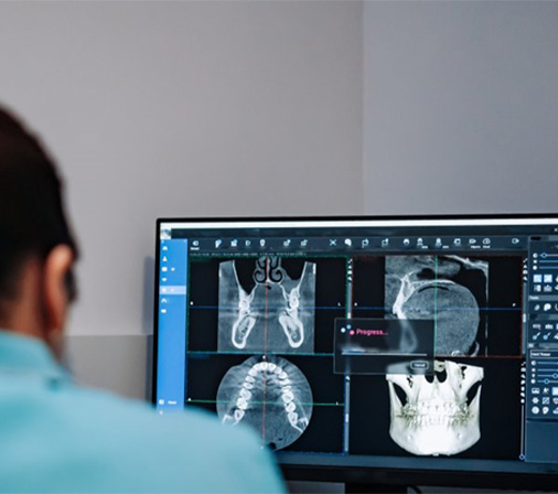 woman giving thumbs up in dental chair