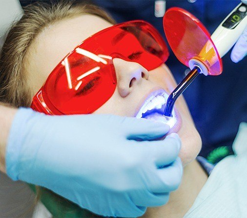 Patient receiving dental bonding treatment