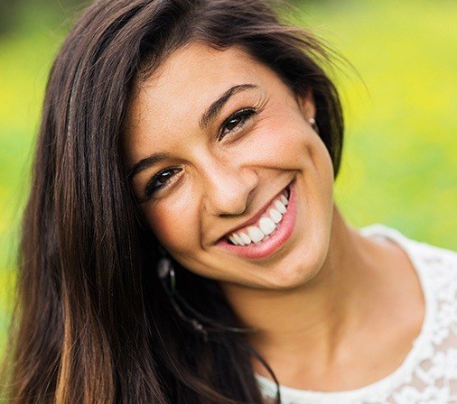 Woman with bright smile outdoors