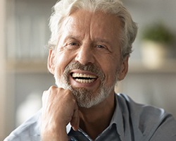 An older man looking straight into the camera