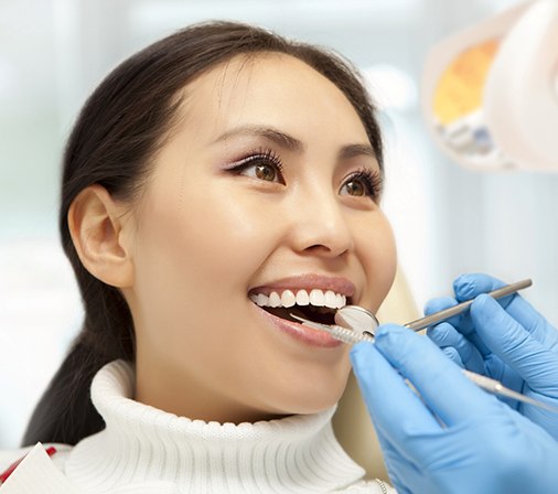 Woman smiles after visiting her dentist 