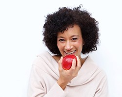 Woman eating an apple