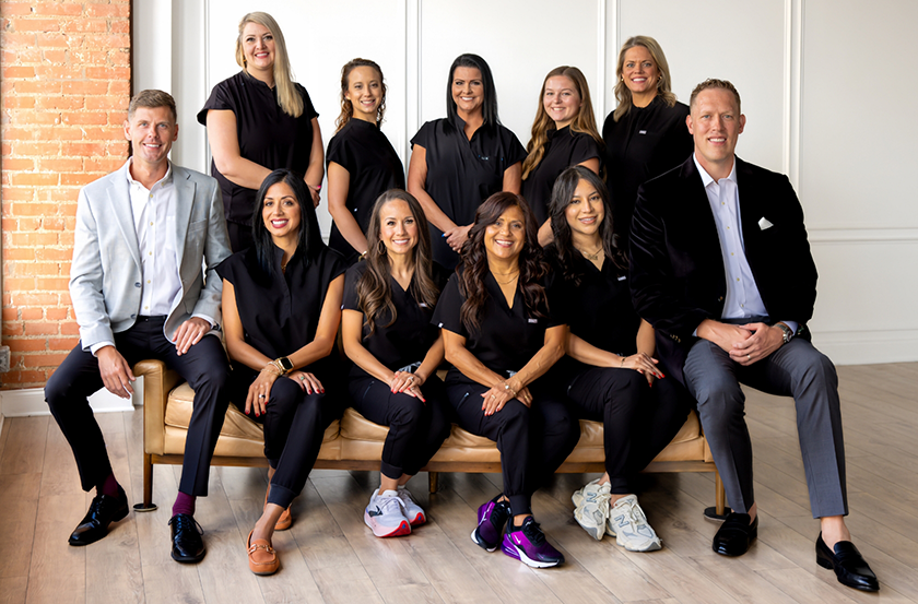 Midlothian dentist surrounded by dental team