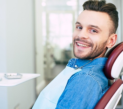 Man smiling after completing Invisalign in Midlothian