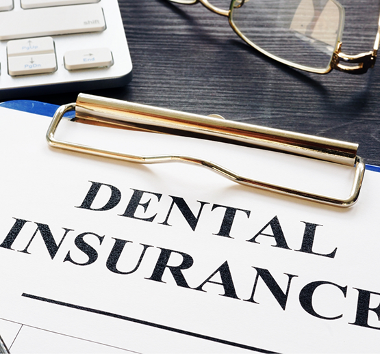 Close-up of dental insurance form on clipboard