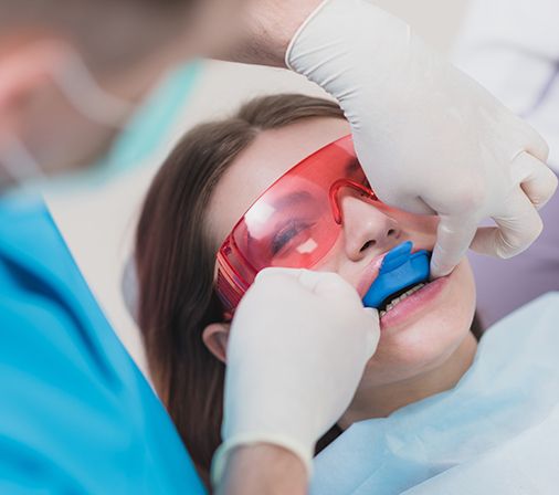 Child receiving fluoride treatment