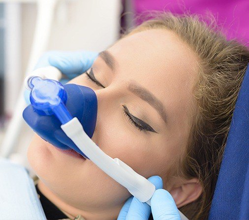 Woman with nitrous oxide nasal mask