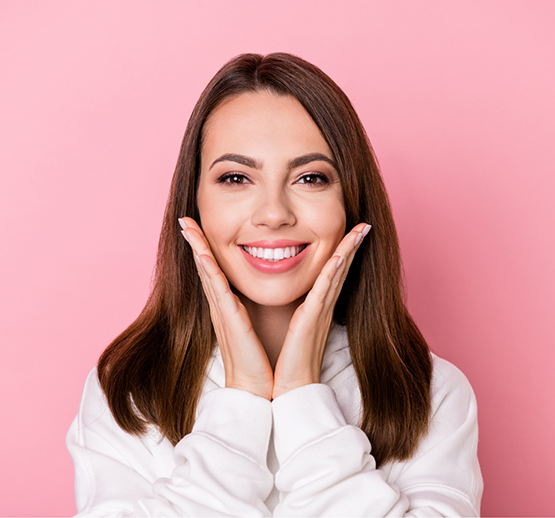 Close-up of woman in sweater smiling
