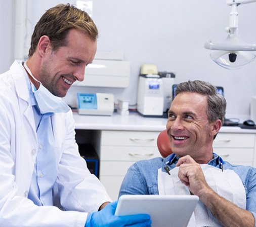 dentist speaking to patient